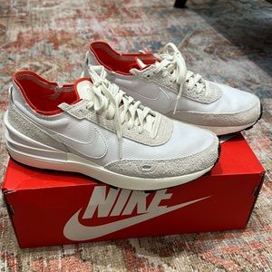 Nike tennis shoes with orange and suede details